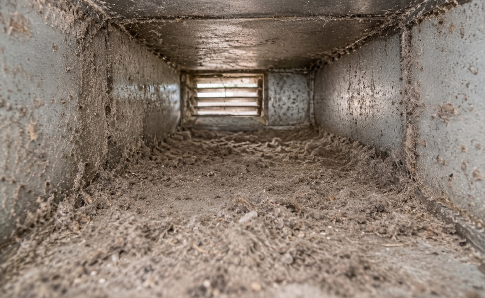 Heavy dust accumulation inside residential air ducts before professional cleaning